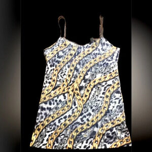 Cache Women's Silver and Gold strap top.
Chain design shirt  -Has lace on top Lg